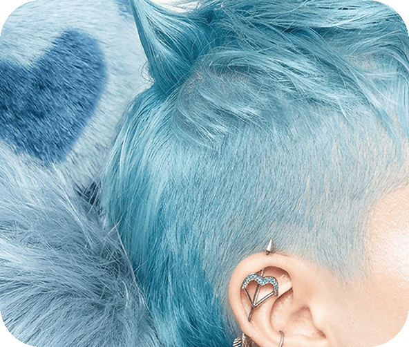 Close-up portrait with blue-tinted hair and an ear cuff